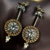 Two-tone traditional bird design dangler earrings with pearl and stone work