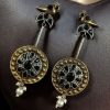 Two-tone traditional bird design dangler earrings with pearl and stone work