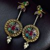 Two-tone traditional bird design dangler earrings with pearl and stone work