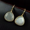 Lightweight gold plated triangle hook earrings with Monalisa stone for daily wear
