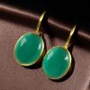 Handmade gold plated hook earrings with Monalisa stone for daily wear.