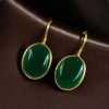 Handmade gold plated hook earrings with Monalisa stone for daily wear.