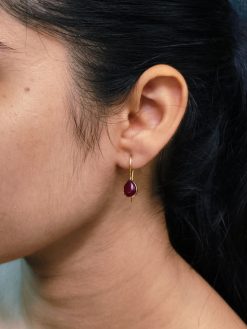 Gold plated drop shape earrings with stone work and hook dangler design