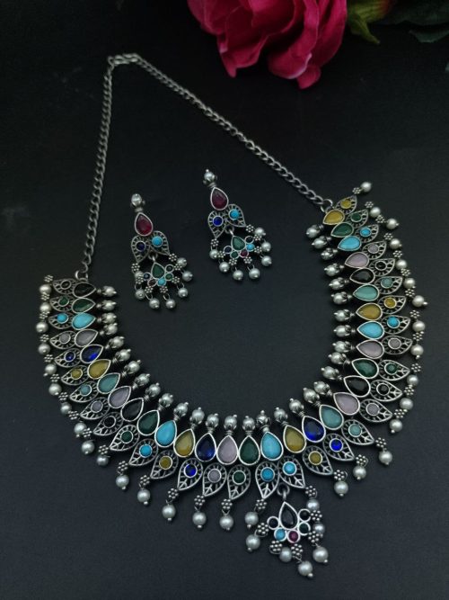 Silver plated leaf design necklace set with stone and pearl work.