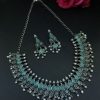 Silver plated leaf design necklace set with stone and pearl work.