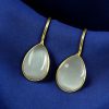Gold-plated ethnic drop shape dangler earrings with hook style