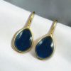 Gold-plated ethnic drop shape dangler earrings with hook style