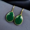 Gold-plated ethnic drop shape dangler earrings with hook style