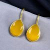 Gold-plated ethnic drop shape dangler earrings with hook style