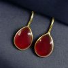 Gold-plated ethnic drop shape dangler earrings with hook style