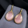 Gold-plated ethnic drop shape dangler earrings with hook style