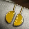 Gold plated half circle earrings with Monalisa stone and hook design
