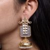 Gold plated floral art jhumka earrings with Monalisa stone and pearl work
