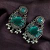 Oxidized silver plated floral earrings with pearl work and Monalisa stone.