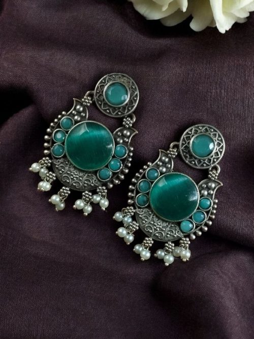 Oxidized silver plated floral earrings with pearl work and Monalisa stone.