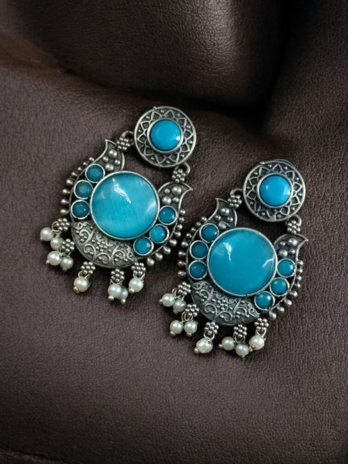 Oxidized silver plated floral earrings with pearl work and Monalisa stone.