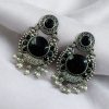 Oxidized silver plated floral earrings with pearl work and Monalisa stone.