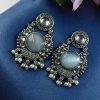 Oxidized silver plated floral earrings with pearl work and Monalisa stone.