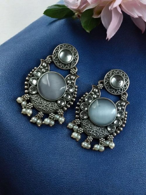 Oxidized silver plated floral earrings with pearl work and Monalisa stone.