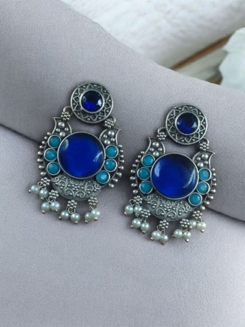 Oxidized silver plated floral earrings with pearl work and Monalisa stone.