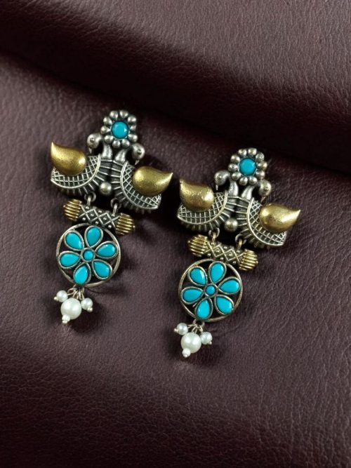 Two-tone bird earrings with pearl and stone work, lightweight ethnic dangler.