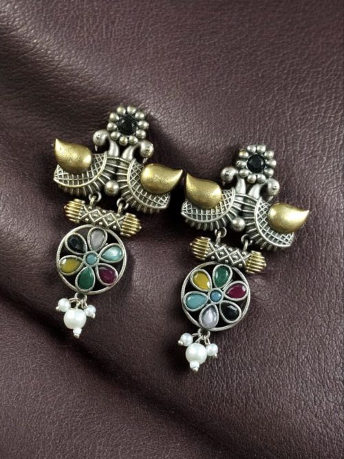Two-tone bird earrings with pearl and stone work, lightweight ethnic dangler.