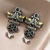 Two-tone bird earrings with pearl and stone work, lightweight ethnic dangler.