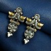 Two-tone bird earrings with pearl and stone work, lightweight ethnic dangler.