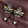 Two-tone bird earrings with pearl and stone work, lightweight ethnic dangler.