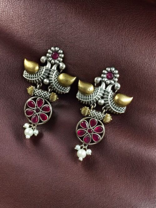 Two-tone bird earrings with pearl and stone work, lightweight ethnic dangler.