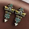 Two-tone bird earrings with pearl and stone work, lightweight ethnic dangler.