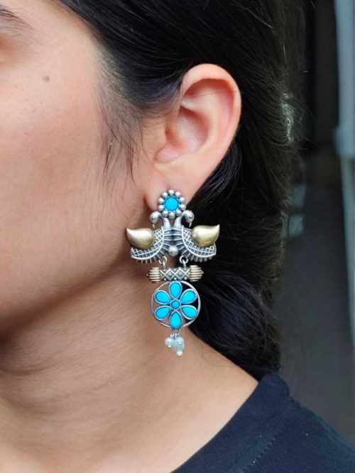 Two-tone bird earrings with pearl and stone work, lightweight ethnic dangler.