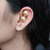 Gold plated flower design earcuff lightweight ethnic daily wear jewelry.