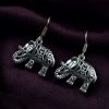 Lightweight German silver elephant dangler hook earrings for everyday and casual wear.