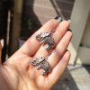 Lightweight German silver elephant dangler hook earrings for everyday and casual wear.