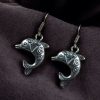 German silver dolphin dangler hook earrings for daily wear and casual outfits.