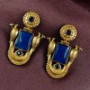 Traditional gold plated earrings with bird design and green stones in vintage style.