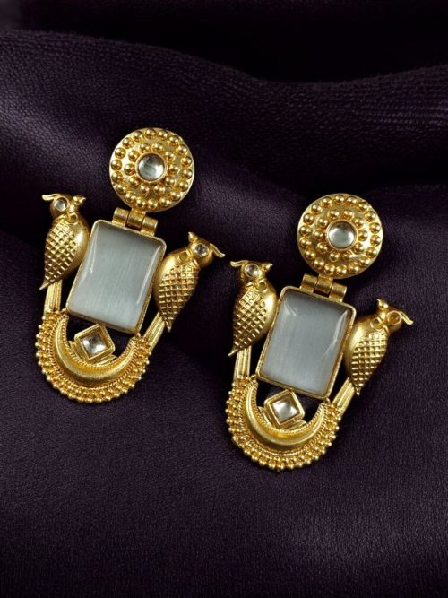 Traditional gold plated earrings with bird design and green stones in vintage style.