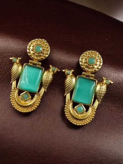 Traditional gold plated earrings with bird design and green stones in vintage style.