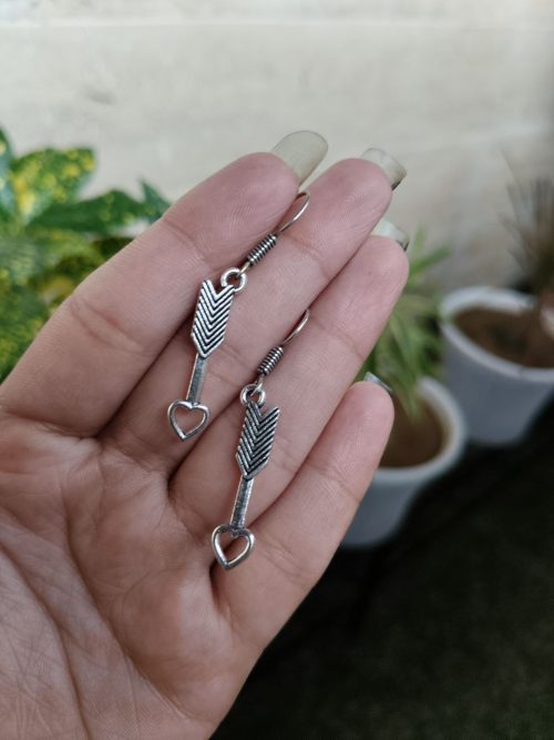 Heart arrow dangler earrings in German silver with hook for western casual wear.