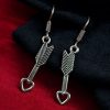 Heart arrow dangler earrings in German silver with hook for western casual wear.