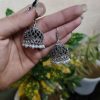 German silver jhumka earrings with pearl work and hook, ethnic dangler design.