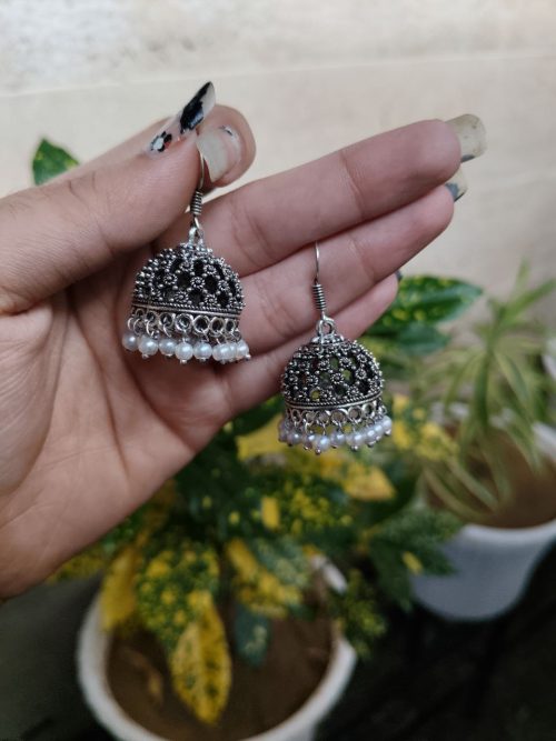 German silver jhumka earrings with pearl work and hook, ethnic dangler design.