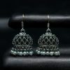 German silver jhumka earrings with pearl work and hook, ethnic dangler design.