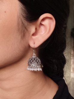 German silver jhumka earrings with pearl work and hook, ethnic dangler design.