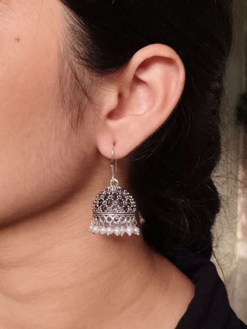 German silver jhumka earrings with pearl work and hook, ethnic dangler design.