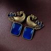 Two-tone peacock earrings with stone work in traditional look alike design.