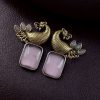 Two-tone peacock earrings with stone work in traditional look alike design.