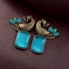 Two-tone peacock earrings with stone work in traditional look alike design.