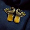 Two-tone peacock earrings with stone work in traditional look alike design.